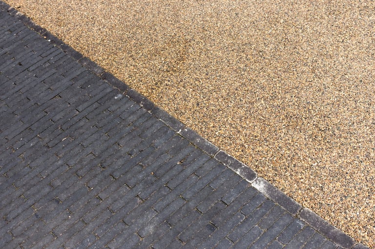 Resin bound driveway with modern block paving and decorative gravel border