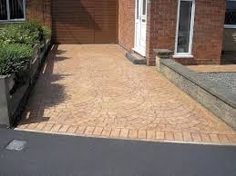 Brick paved driveway with landscaping