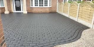 Newly installed dark gray paved driveway